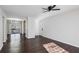 Spacious living area featuring hardwood floors, a ceiling fan, and access to a balcony at 3293 Abbeywood Dr, Decatur, GA 30034
