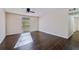 Bright living room with dark hardwood floors and ceiling fan at 3293 Abbeywood Dr, Decatur, GA 30034