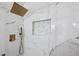 Elegant shower with marble walls, a rainfall shower head, and gold accents at 3293 Abbeywood Dr, Decatur, GA 30034