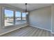 Bright dining area with hardwood floors and large windows at 3688 Elinburg Cove Trl, Buford, GA 30519