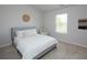 Comfortable bedroom with neutral colors and decor with a light blue bed frame at 4783 Sultana Sw Way, Atlanta, GA 30331