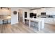 Spacious kitchen featuring white cabinets, stainless steel appliances, an island, and a work station at 4783 Sultana Sw Way, Atlanta, GA 30331