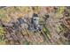 An overhead aerial view of the property showing the house, trees, and land at 675 Mayes Rd, Powder Springs, GA 30127