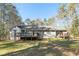 Back exterior of the house showing the deck and stairs at 675 Mayes Rd, Powder Springs, GA 30127