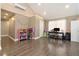 Versatile bonus room with a high ceiling, hardwood floors, and neutral-colored walls at 675 Mayes Rd, Powder Springs, GA 30127