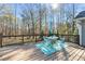 Enjoy this spacious deck area with lovely views of the backyard and mature trees at 675 Mayes Rd, Powder Springs, GA 30127