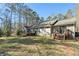 The exterior features decks on the house and a stairway to the backyard at 675 Mayes Rd, Powder Springs, GA 30127