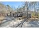 Gray house with stone accents and a long driveway at 675 Mayes Rd, Powder Springs, GA 30127