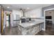 Modern kitchen featuring white cabinetry, stainless steel appliances, and a granite-topped island at 675 Mayes Rd, Powder Springs, GA 30127