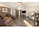 Bright living room boasting hardwood floors, comfortable seating, and a rustic sliding barn door at 675 Mayes Rd, Powder Springs, GA 30127