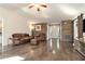 Inviting living room with hardwood floors, rustic wood accent wall, and comfortable seating at 675 Mayes Rd, Powder Springs, GA 30127