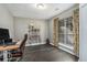 This office features hardwood floors, a large window with lots of light, and a stylish desk at 675 Mayes Rd, Powder Springs, GA 30127