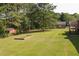 Large backyard with shed and garden area at 1308 Crumbley Rd, Mcdonough, GA 30252