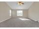 Spacious bedroom with carpeted floor and ceiling fan at 1308 Crumbley Rd, Mcdonough, GA 30252