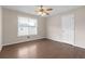 Bedroom with laminate floors and ceiling fan at 1308 Crumbley Rd, Mcdonough, GA 30252