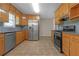 Kitchen with stainless steel appliances and wood cabinets at 1308 Crumbley Rd, Mcdonough, GA 30252