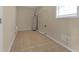 Laundry room with water heater and tile floor at 1308 Crumbley Rd, Mcdonough, GA 30252