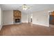 Living room with stone fireplace and laminate flooring at 1308 Crumbley Rd, Mcdonough, GA 30252