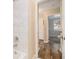 Clean bathroom with marble-look tile and bathtub at 1903 Wildwood Dr, Decatur, GA 30032