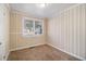 Bright bedroom with neutral walls and carpet at 1903 Wildwood Dr, Decatur, GA 30032