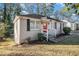 Side view of a renovated brick ranch house at 1903 Wildwood Dr, Decatur, GA 30032