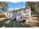 Back exterior view of a house with a yard at 1903 Wildwood Dr, Decatur, GA 30032