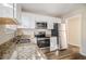 Renovated kitchen, granite counters, stainless steel appliances at 1903 Wildwood Dr, Decatur, GA 30032