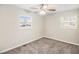 Spacious bedroom with neutral carpeting and two windows at 2352 Scotty Cir, Decatur, GA 30032