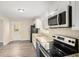 Renovated kitchen, featuring stainless steel appliances and granite countertops at 2352 Scotty Cir, Decatur, GA 30032