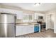 Modern kitchen with white cabinets, granite countertops, and stainless steel appliances at 2352 Scotty Cir, Decatur, GA 30032