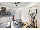 Bright home gym with treadmill, elliptical, and weight bench at 5226 Wheeler Dr, Loganville, GA 30052