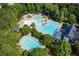 Aerial view of community pool, tennis courts, and clubhouse at 505 Blue Mountain Rise, Canton, GA 30114