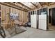 Unfinished basement with basketball game and refrigerator at 505 Blue Mountain Rise, Canton, GA 30114