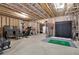 Large unfinished basement with a home gym and golf simulator at 505 Blue Mountain Rise, Canton, GA 30114