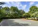 Well-maintained outdoor basketball court, surrounded by trees at 505 Blue Mountain Rise, Canton, GA 30114