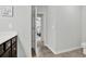 Bathroom with dark vanity, toilet, and view into bedroom at 505 Blue Mountain Rise, Canton, GA 30114