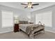Bedroom with a metal bed frame, two nightstands, and ceiling fan at 505 Blue Mountain Rise, Canton, GA 30114
