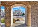 View through brick archway showing a residential street at 505 Blue Mountain Rise, Canton, GA 30114