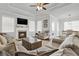 Spacious living room with fireplace and hardwood floors at 505 Blue Mountain Rise, Canton, GA 30114