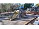 Community playground with slides and play structure at 11170 Bentley Chase Dr, Johns Creek, GA 30097