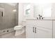Bathroom with shower, toilet and white vanity at 488 Broom Dr, Cumming, GA 30040