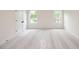Spacious bedroom with carpet and multiple windows at 488 Broom Dr, Cumming, GA 30040