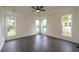 Bright bedroom with hardwood floors and multiple windows at 488 Broom Dr, Cumming, GA 30040