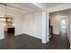 Open dining room with dark hardwood floors and views into the kitchen at 488 Broom Dr, Cumming, GA 30040