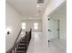 Upstairs hallway with carpet, stairs, and doors to bedrooms at 488 Broom Dr, Cumming, GA 30040