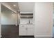 Built-in wet bar with white cabinets, quartz countertop, and floating shelves at 488 Broom Dr, Cumming, GA 30040