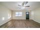 Bright living room with hardwood floors and ceiling fan at 20 Porter Ct, Hampton, GA 30228