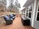Relaxing back deck with comfortable seating, a grill, and an outdoor storage container at 213 Moore Valley Way, Canton, GA 30115