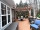 Spacious back deck featuring a pergola, dining area, and seating for outdoor enjoyment at 213 Moore Valley Way, Canton, GA 30115