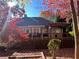 Charming backyard with large deck, a pergola and colorful foliage at 213 Moore Valley Way, Canton, GA 30115